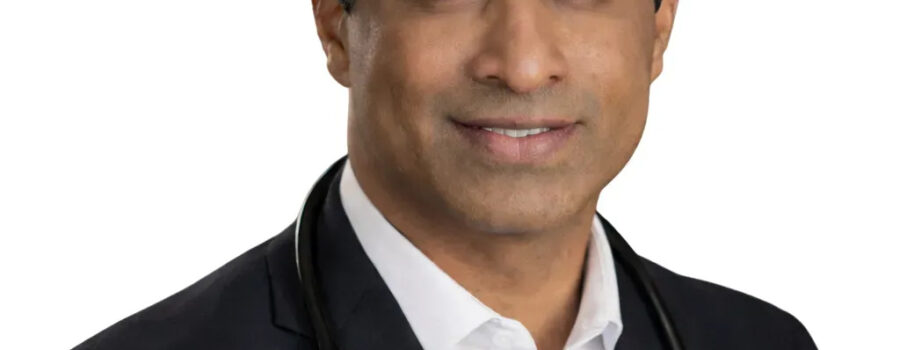 Professional man in a suit with a stethoscope around his neck.