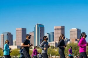 Phoenix city skyline with people exercising outdoors, highlighting the impact of air quality on health